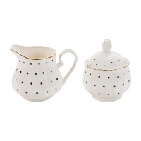 Suikerpot en melkkan met zwarte stippen en gouden rand
