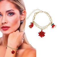 Armband met gouden kerstmuts, bel en bloem - 1 stuk